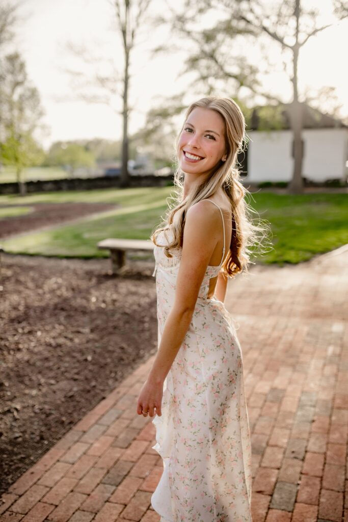 Smiling blonde haired teen girl in front of Rose Hill Manor in Frederick, MD.
